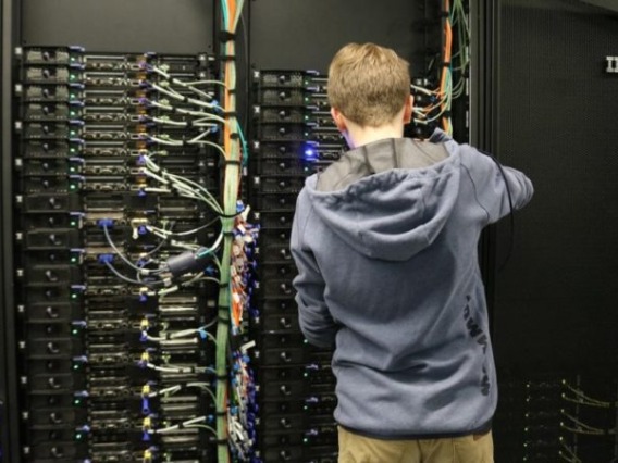 research computing staffer at University of Arizona updating a supercomputer