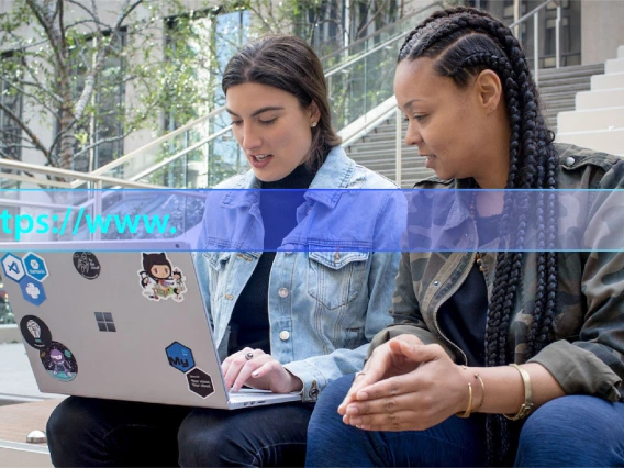 Students Looking at Laptop