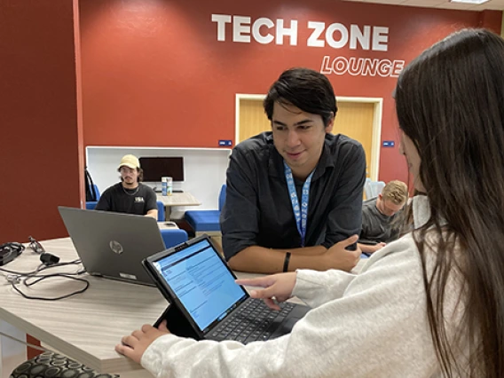 Students working on Laptop at Tech Zone