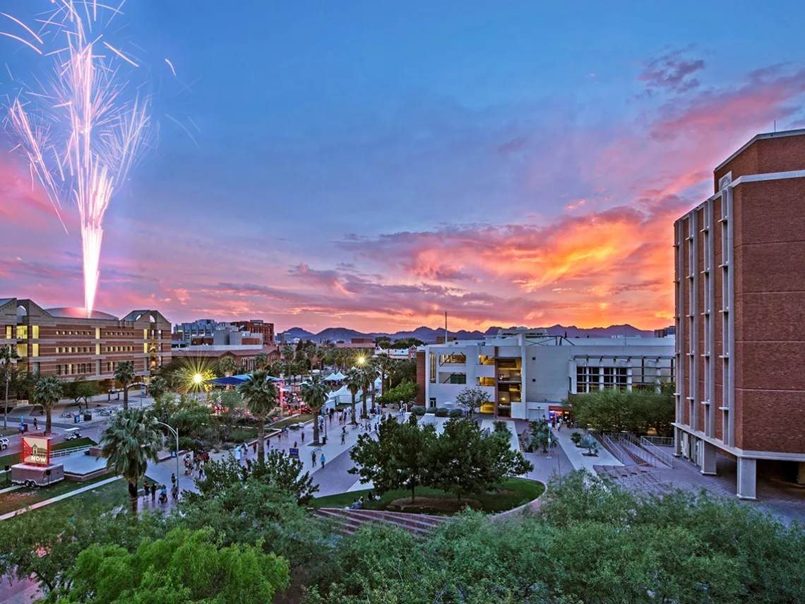 fireworks shoot off on campus, during sunset