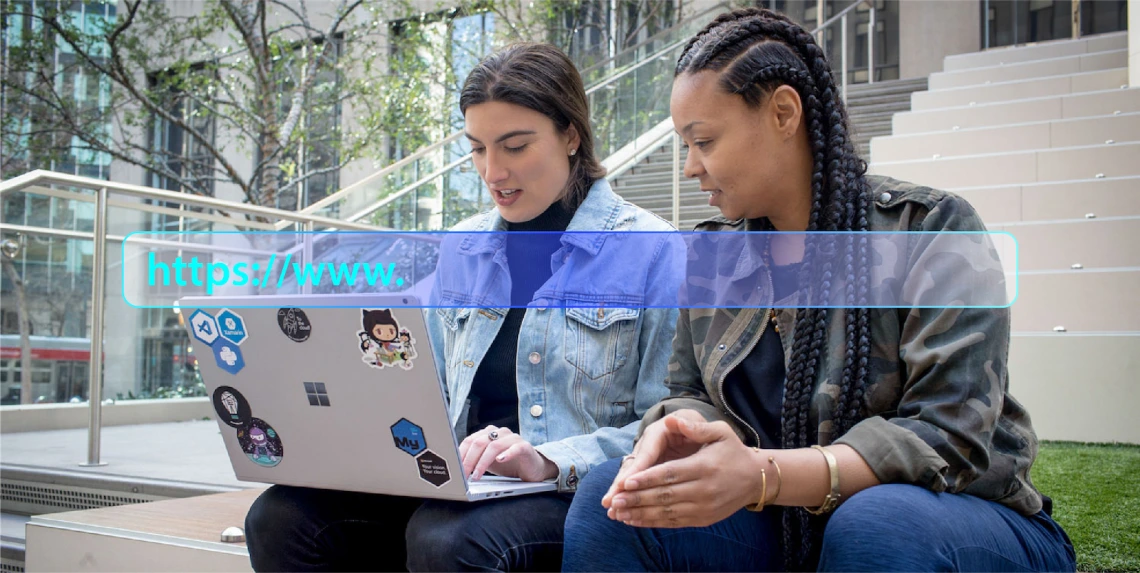 Students Looking at Laptop