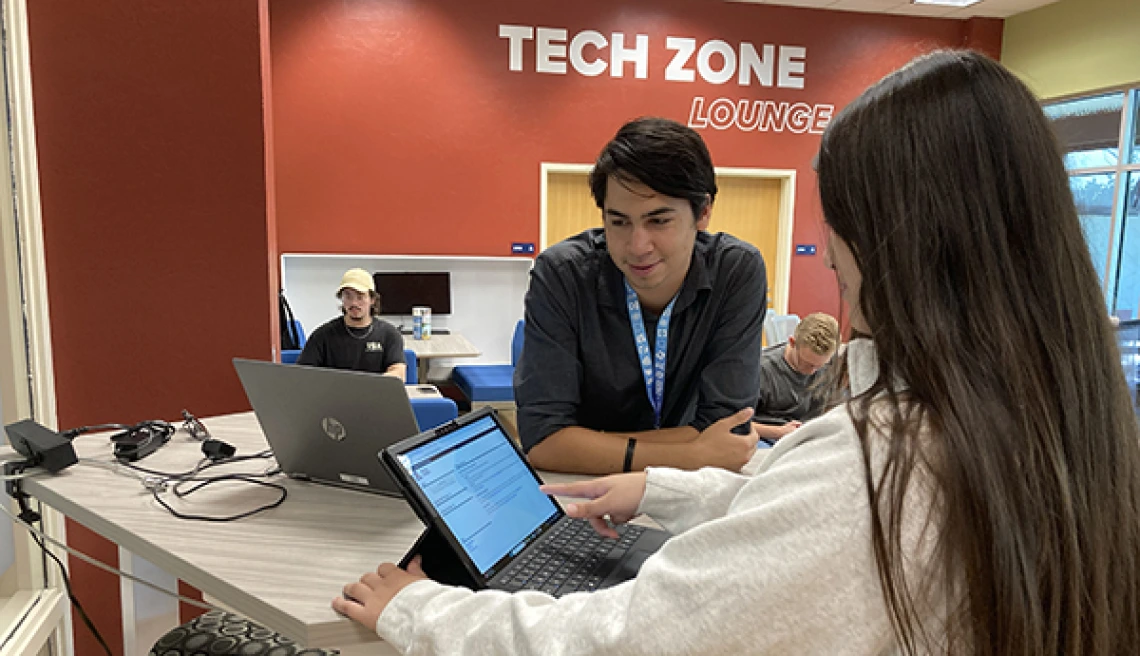 Students working on Laptop at Tech Zone